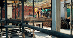 Construction, scaffolding and man with planning on site for renovation, code compliance or safety. Civil engineering, foreman and project management outdoor for building upgrade, inspection or review