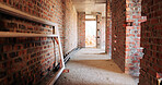 Bricks, construction and empty building with hallway for infrastructure and property development. Architecture, civil engineering and interior of site for process, renovation and remodeling project