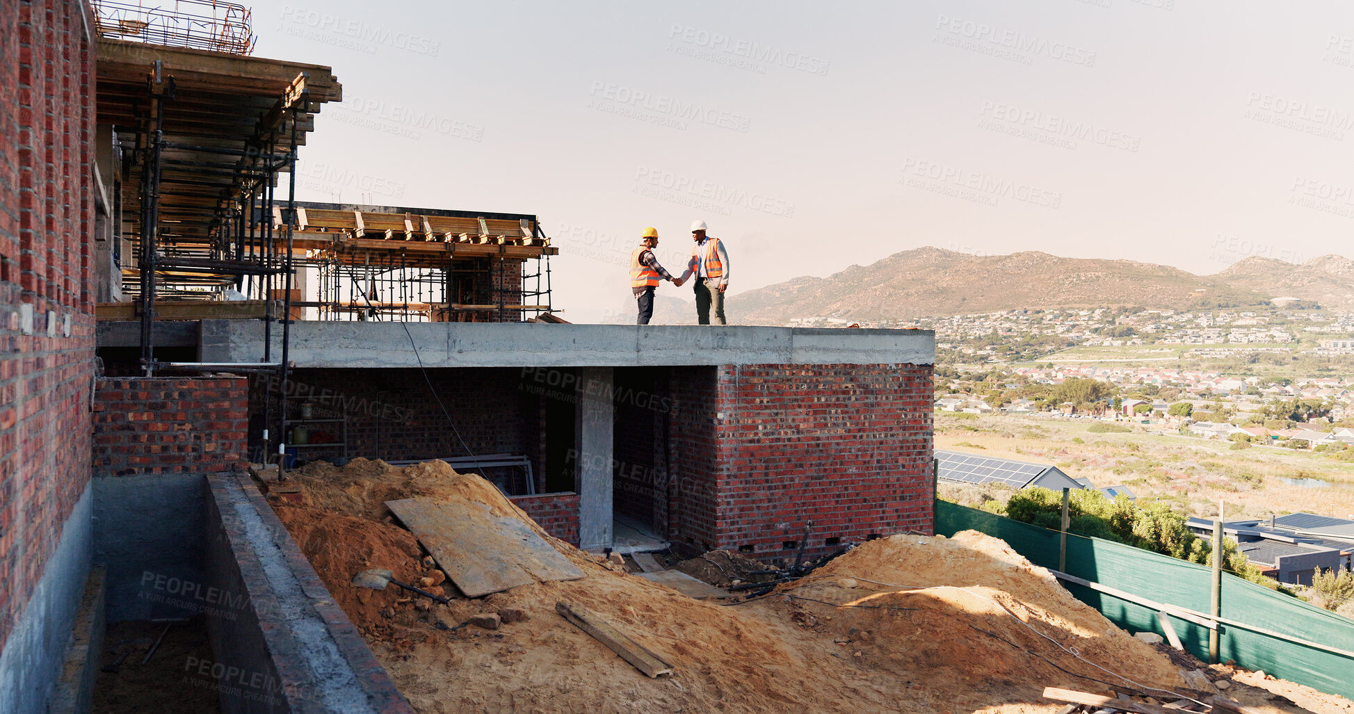 Buy stock photo Architect, handshake and men on rooftop, construction site or collaboration for architecture project. Civil engineering, shaking hands and people with gesture on building space, agreement or teamwork