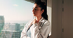 Doctor, woman or thinking at clinic window for clinical insight, diagnostic challenge or idea. Healthcare, professional or contemplating in hospital for treatment plan, medical decision or reflection
