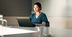 Nurse, typing and woman with laptop in clinic, administration and reading medical records on website. Healthcare specialist, online and person with tech for test results, info or research in hospital