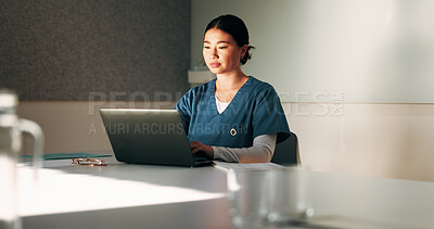 Buy stock photo Nurse, typing and woman with laptop in clinic, admin and reading medical records on website. Healthcare specialist, online and Asian person with tech for test results, info or research in hospital