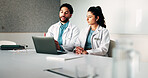 Doctors, team and laptop with planning at hospital in boardroom, review and discussion for healthcare. People, medical professional and meeting with computer, feedback or services at wellness clinic