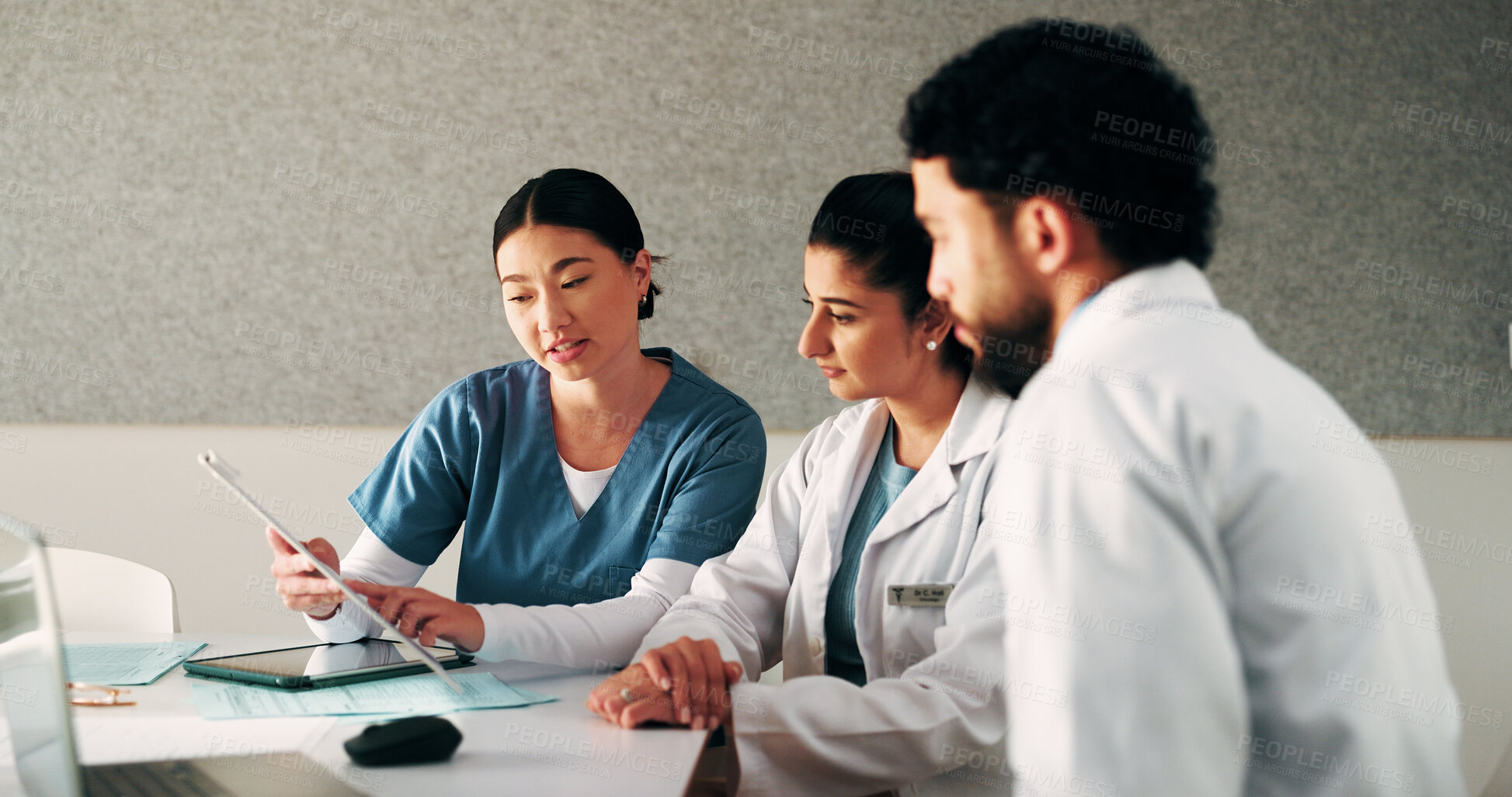Buy stock photo Doctors, team and clipboard with meeting at clinic in boardroom, pointing and planning for healthcare. People, medical professional and insight with tech, feedback or wellness services at hospital