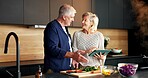 Tablet, smile and senior couple in kitchen with online recipe for dinner, meal or healthy food in home. Digital technology, happy and elderly man with woman for cooking instructions on app in house.