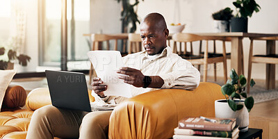 Buy stock photo Documents, finance and laptop with black man on sofa in home living room for remote work. Computer, paperwork and reading with financial employee in apartment for budget report as freelance worker