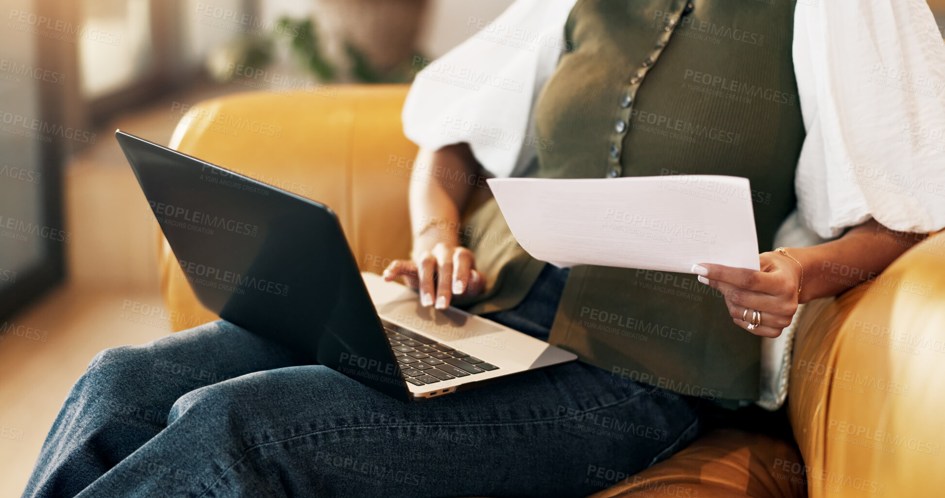 Buy stock photo Woman, hands and paperwork in home with laptop, remote work and administration for tax preparation. Freelancer, female person and browsing on sofa with computer, document and revenue service website.