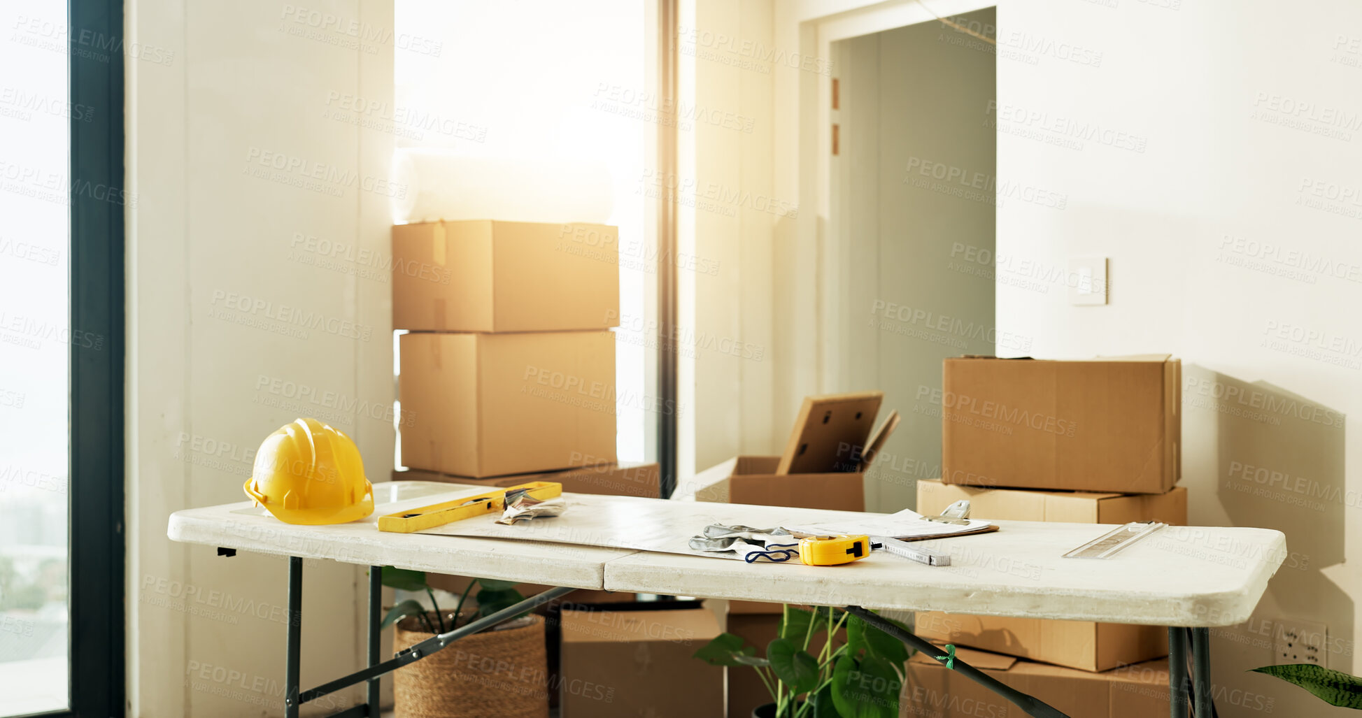 Buy stock photo Interior design, tools and boxes in new home for renovation, planning and table for relocation. Equipment, clipboard and cardboard for property construction, floor plan and maintenance of diy project