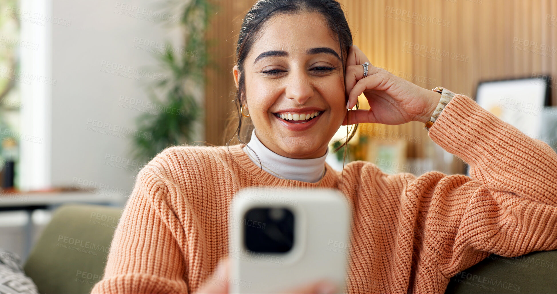 Buy stock photo Video call, happy or woman in house with phone, online chat or communication on dating site. Smile, digital or person on couch with tech, virtual conversation or connection on matchmaking platform.