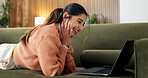 Smile, relax and woman at house with laptop, social media and streaming movies on website. Happy, female person and laugh in home with tech, comedy video and download film for weekend break in lounge
