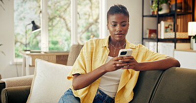 Buy stock photo Digital, message and black woman in house with phone, online chat and post reaction on social media. Typing, contact and person with technology, texting update or communication on mobile app.