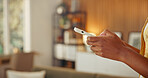 Digital, message and hands in home with phone, online communication and post reaction on social media. Typing, contact and person in house with technology, texting update or chatting on virtual app.