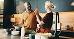 Kitchen, high five and senior couple for cooking, cuisine and meal prep for dinner or lunch. Interracial, marriage and man with woman with success for new recipe, ingredients and culinary skills
