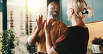 Happy, high five and couple in kitchen for cooking, cuisine and meal prep for dinner or lunch. Interracial, marriage and man with woman with success for new recipe, ingredients and culinary skills