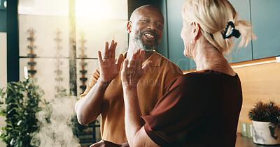 Buy stock photo Happy, high five and couple in kitchen for cooking, cuisine and meal prep for dinner or lunch. Home, mature and man with woman with success for recipe, support and help for interracial marriage
