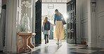 Mom, leaving and girl in home with backpack, support and back to school for education. Woman, walking or front door with daughter for commute, morning routine and bonding together for learning
