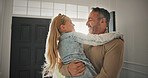 Excited, girl and dad in home for greeting, anticipation and affection for homecoming. Daughter, father and hug by front door for welcome, family reunion and bonding together for parent arrival