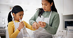 Mom, girl and baking in kitchen with help, teaching recipe and bonding with dessert in home. Learning, kid and mother with education, discussion and family with ingredients for child development