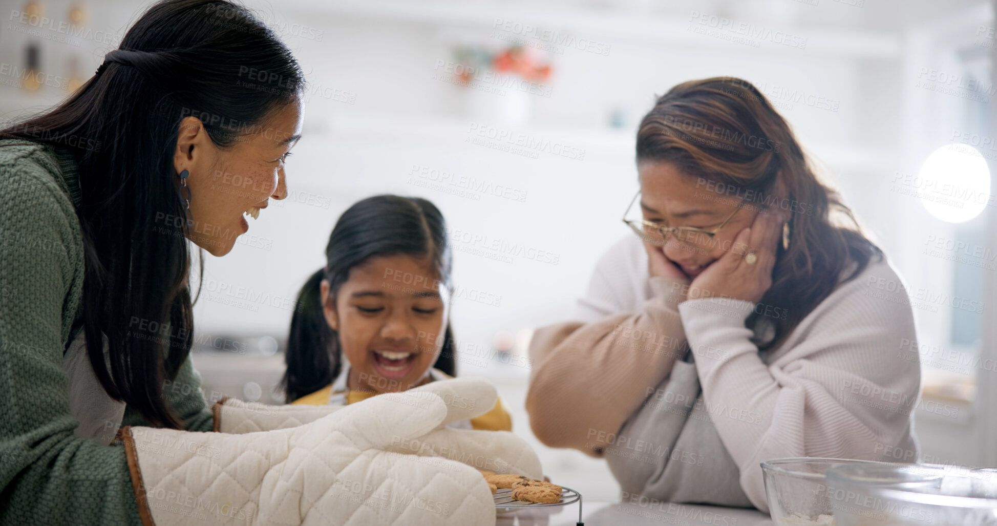 Buy stock photo Surprise, family and cookies in home for baking, learning and bonding with homemade treats. Mother, grandmother and biscuits in kitchen with grandchild, culinary skills and excited for baked dessert