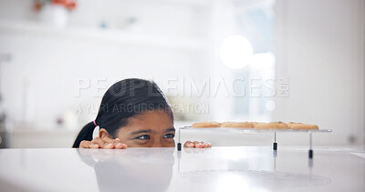 Buy stock photo Sneaky, kitchen and child by counter with biscuits, sweet treats or dessert for unhealthy snack. Smile, naughty and girl with secret, stealing and taking cookies for eating, hungry or craving in home