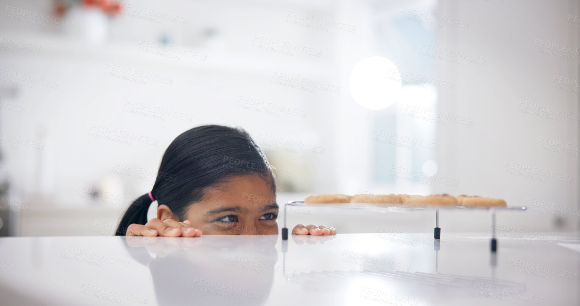 Buy stock photo Sneaky, kitchen and child by counter with biscuits, sweet treats or dessert for unhealthy snack. Smile, naughty and girl with secret, stealing and taking cookies for eating, hungry or craving in home