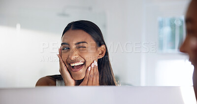 Buy stock photo Woman, skincare and wink at mirror in bathroom, cosmetics and smile with healthy skin and hydration. Reflection, check and happy person with glow, self care and pride for dermatology benefits in home