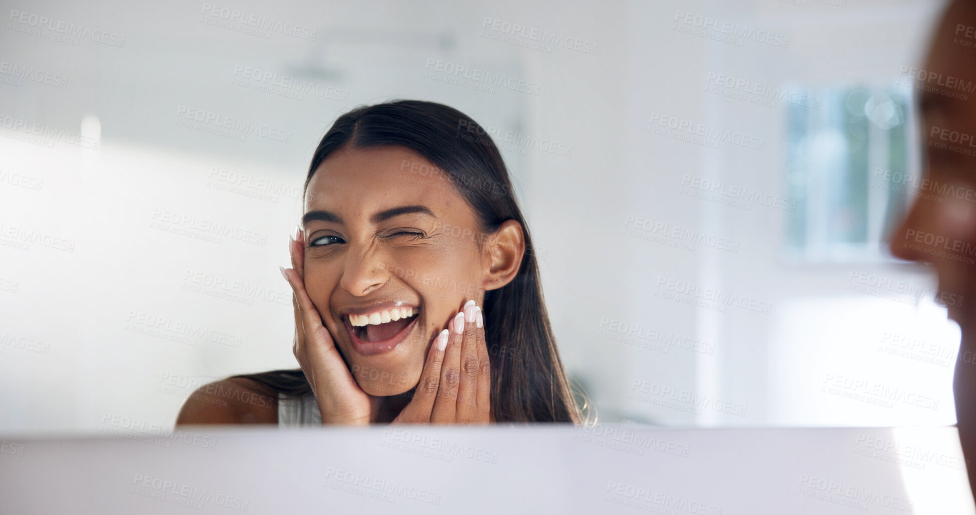 Buy stock photo Woman, skincare and wink at mirror in bathroom, cosmetics and smile with healthy skin and hydration. Reflection, check and happy person with glow, self care and pride for dermatology benefits in home