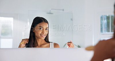 Buy stock photo Woman, mirror and brush in bathroom for haircare, beauty and healthy shine for keratin treatment. Reflection, person and brushing hair at house for texture, frizz control and cosmetics for scalp care