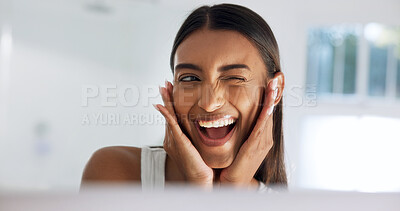 Buy stock photo Woman, self care and wink at mirror in bathroom, cosmetics and smile with healthy skin and hydration. Reflection, check and happy person with glow, skincare and pride for dermatology benefits in home