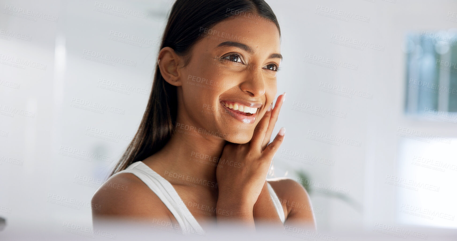 Buy stock photo Mirror, check and happy woman in bathroom, skincare and cosmetics for healthy skin glow or hydration. Home, reflection and Indian person with smile, confident and self care with dermatology benefits