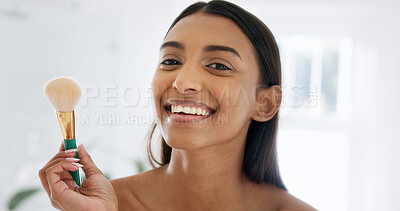 Buy stock photo Bathroom, portrait and happy woman with makeup brush, cosmetics and foundation application in house. Indian person, beauty and morning routine with equipment, cosmetology and skincare in apartment