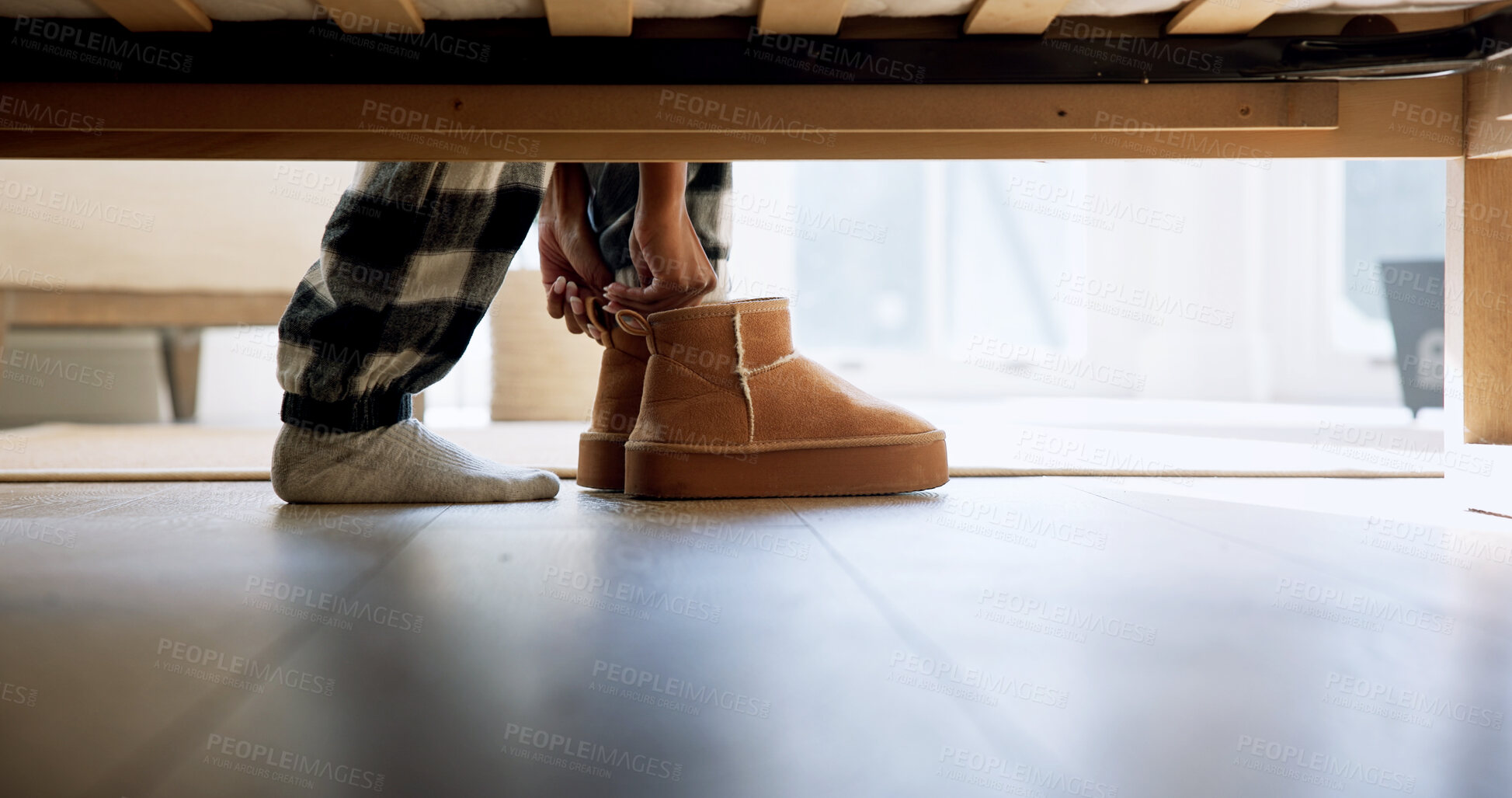 Buy stock photo Morning, shoes and person with slippers in bedroom for waking up, routine and relax in home. Bed, comfort and feet of woman with soft pajamas, footwear and weekend or winter holiday with break