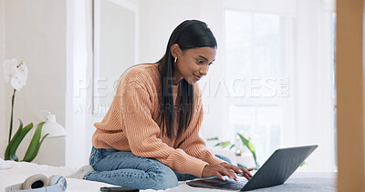 Buy stock photo Creative, freelancer and happy woman with laptop on bed, typing and video editing on web in bedroom. Editor, home and Indian person with tech, remote work and content creation on social media app