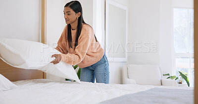 Buy stock photo Tidy, morning and woman with pillow in bedroom for cleaning, maintenance and housework. Neat, happy and person with daily routine for hygiene, housekeeping and straighten bed to organize in home