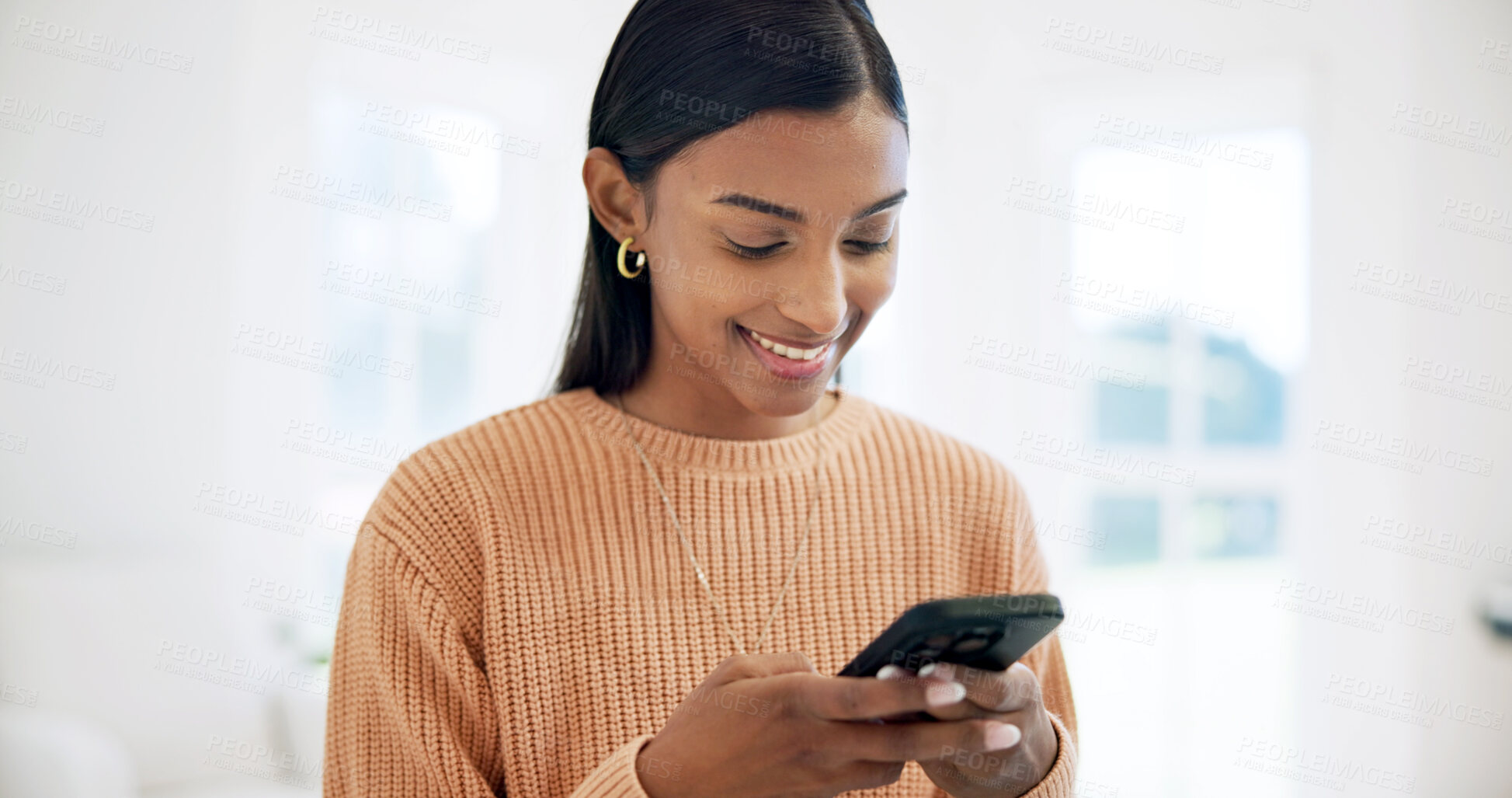 Buy stock photo Smile, reading and woman in home with phone, social media and browsing website for ebook. Happy, female person and typing at house with mobile app, streaming video and notification for message update
