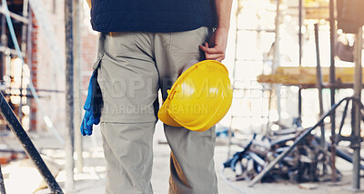 Buy stock photo Hand, architecture and legs of man with helmet for safety, construction site or building project. Back, employee person and hard hat for protection, engineer compliance or inspection for renovation