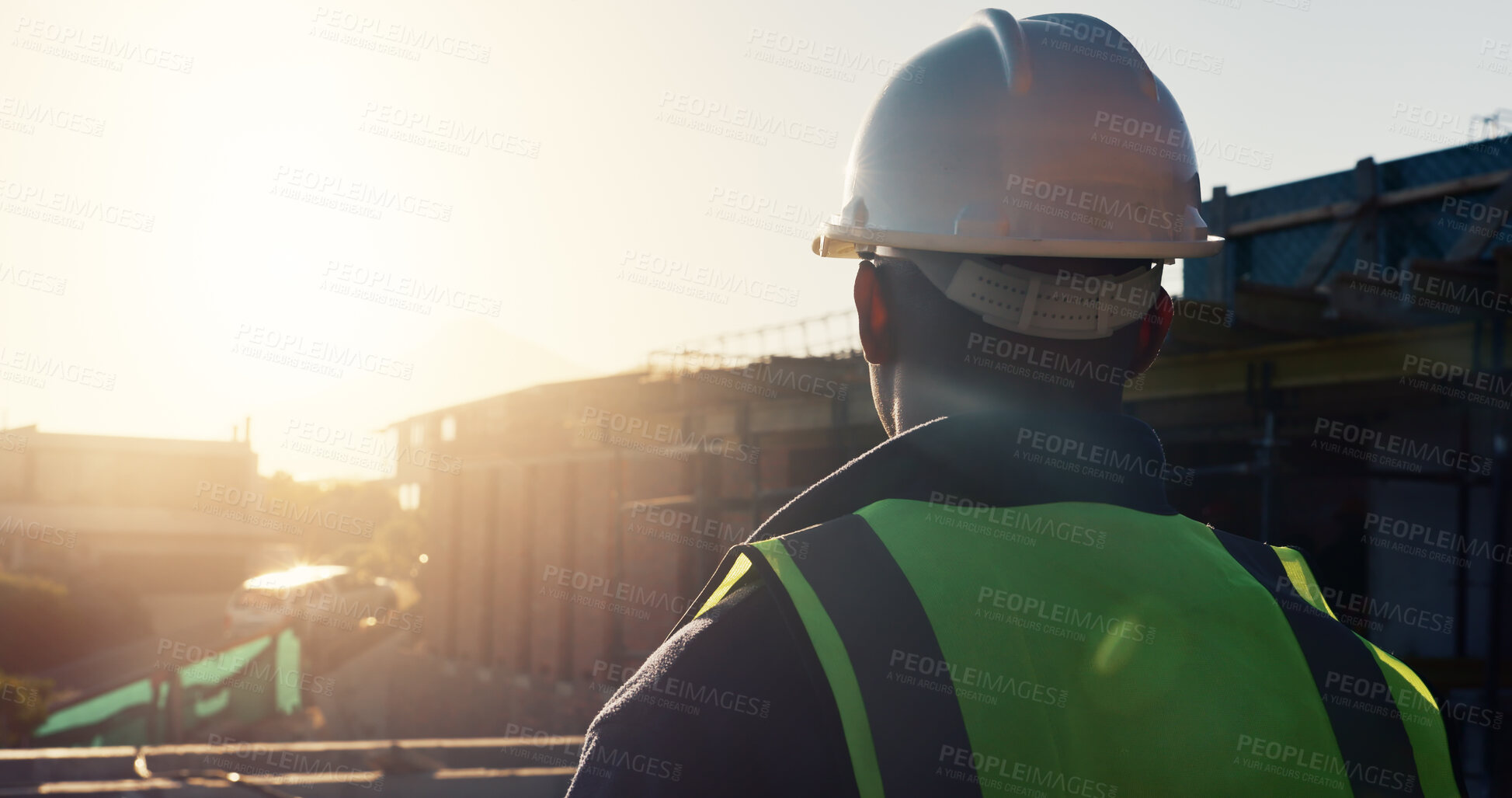 Buy stock photo Sunset, man and architect outdoor for construction, inspection and building development. Back, male person and quality assurance with view, urban planning and reflection on architecture progress