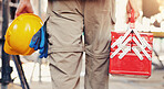 Hand, toolbox and man with helmet for safety, construction site or building project. Back, person and maintenance with hard hat for protection, engineering compliance or inspection for renovation