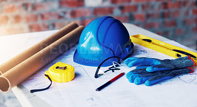 Buy stock photo Construction, blueprint and helmet with tools on table for renovation, building design or planning. Architecture, equipment and floor plan on site for real estate development, safety gear or drafting