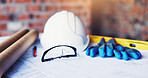 Architecture, blueprint or glasses with tools on table for project development, design or planning. Civil engineering, equipment or floor plan on site for building layout, safety gear or construction