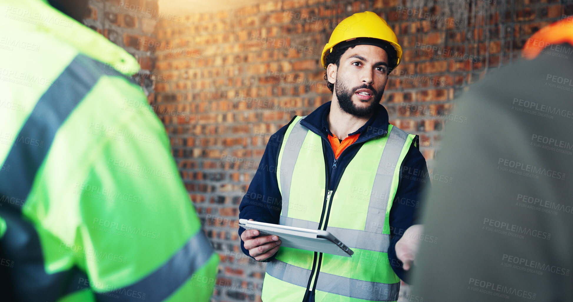 Buy stock photo Construction site, engineering and man with discussion, tablet for online schedule and feedback. People, architecture and employees with teamwork, internet and tech for renovation and conversation