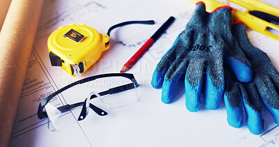 Buy stock photo Architecture, blueprint or gloves with tools on table for renovation, design process or planning. Property development, equipment or tape measure at construction site for drafting, safety gear or PPE