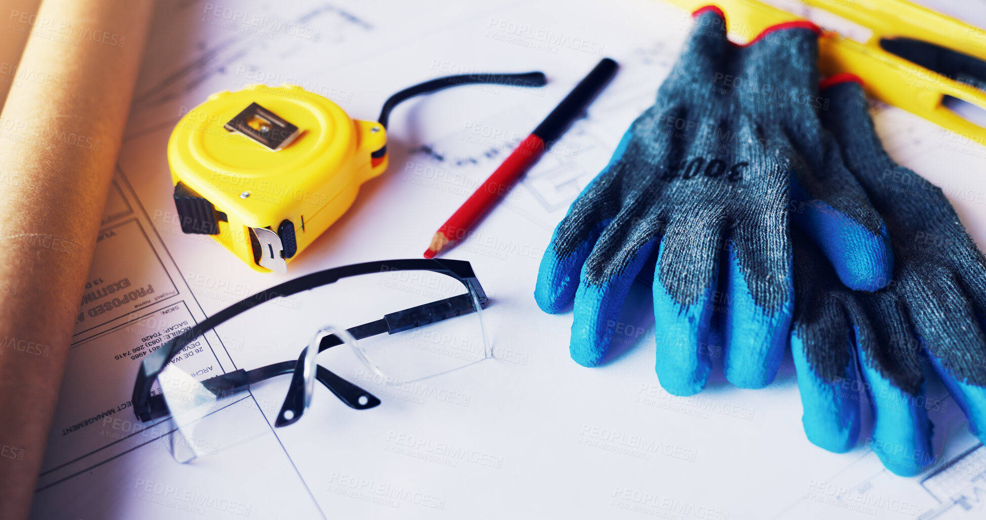 Buy stock photo Architecture, blueprint or gloves with tools on table for renovation, design process or planning. Property development, equipment or tape measure at construction site for drafting, safety gear or PPE