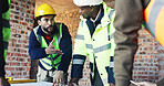 Engineer, architect and team in meeting for discussion, update and planning at construction site. Men, group collaboration and project or floor plan for renovation, expansion or building process