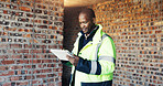 Architect, reading and black man with tablet for construction, research and report for renovation. Person, review and digital at site for architecture, building expansion and information for project