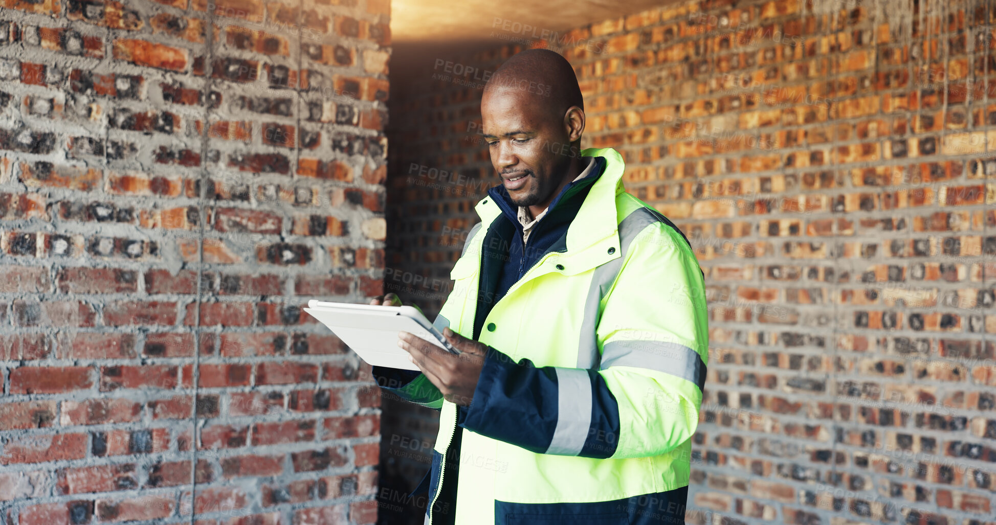 Buy stock photo Architect, reading and black man with tablet for construction, research and report for renovation. Person, review and digital at site for architecture, building expansion and information for project