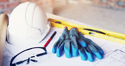Buy stock photo Helmet, architecture and tools in empty office for construction gloves, blueprint or design. Engineering, equipment and safety ppe at building site with development paperwork, spirit level and gear