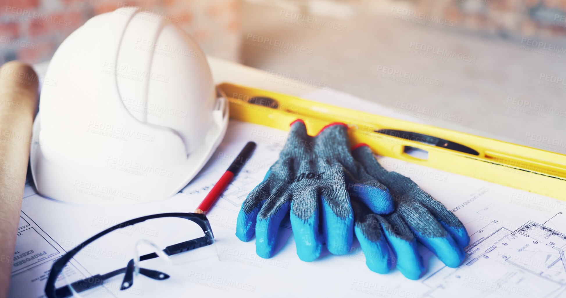Buy stock photo Helmet, architecture and tools in empty office for construction gloves, blueprint or design. Engineering, equipment and safety ppe at building site with development paperwork, spirit level and gear
