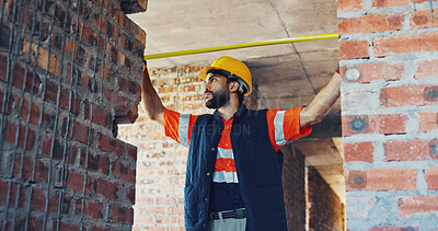 Buy stock photo Inspection, engineer or man with tape measure at construction site, foundation distance or alignment. Space, tools or person with check for building code compliance, structure integrity or accuracy