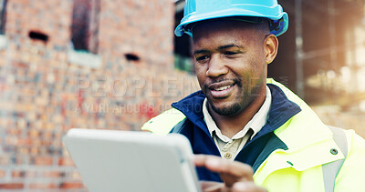 Buy stock photo Construction site, engineering and typing with black man, tablet for online schedule and inspection. African person, architecture or employee with connection, internet or tech for renovation or smile